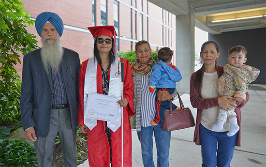 Graduate Amandeep Kaur and her family at the 2022 TRiO graduation.