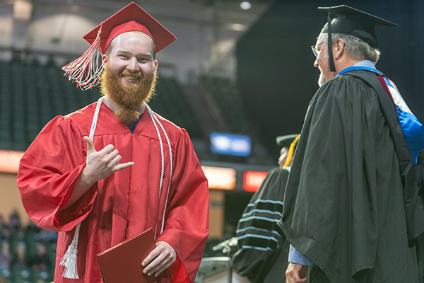 EvCC Electrical Engineering student Bailey Behn receives diploma at commencement ceremony