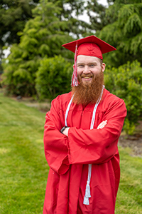 EvCC graduate Bailey Behn wearing graduation cap and gown