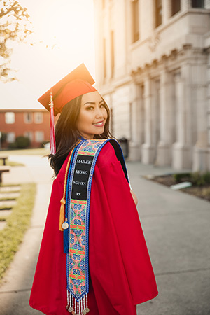 EvCC graduate Mailee Xiong Nguyen in graduate cap and gown