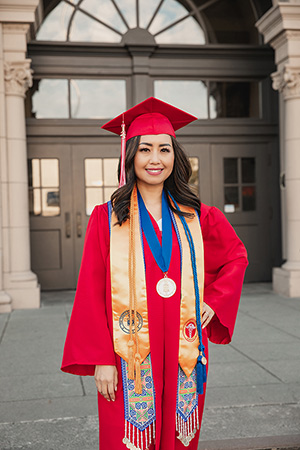 EvCC graduate Mailee Xiong Nguyen in graduation cap and gown