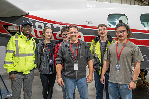 EvCC Aviation student Shad Fleshman-Cooper (center) with fellow students (from left to right) Elijah Kariuki, Alina Nazarchuk, Laura Pollard, Ben Menken and Teaho Noh.