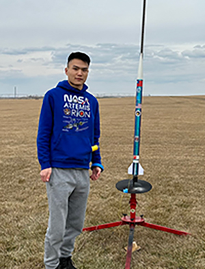 International student William (Po Chun) Chou with rocket built in the STEM (rocket) club at EvCC
