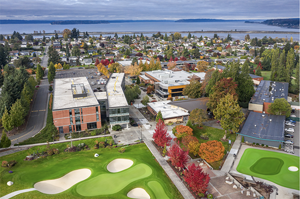 An aerial view of part of EvCC's campus with putting greens in the foreground.