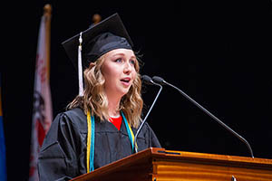 image of Jasmin Chigbrow speaking at graduation