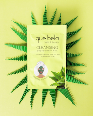 Jade Lofthouse- product photo of 'que bella' cleansing mask on a green background.