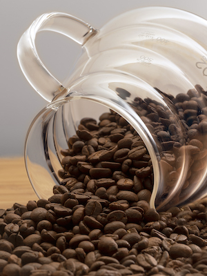 logan maruszak- photo of a coffee pot full of unground beans.